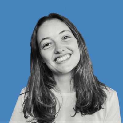 Portrait of a Pana founder, smiling, on a blue background.