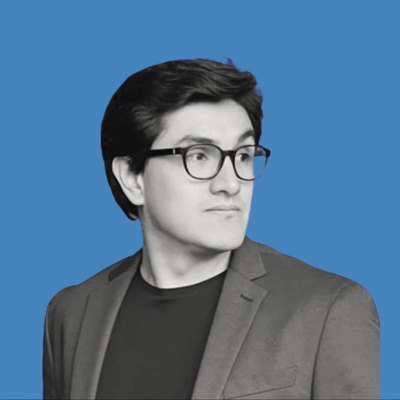 Portrait of a Pana founder in glasses, on a blue background.
